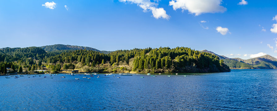 Panorama picture of beautiful lake and mountains under the blue sky in Japan on the winter season.