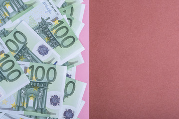 Euro cash on a pink and brown background. Euro Money Banknotes. Euro Money. Euro bill. Place for text.