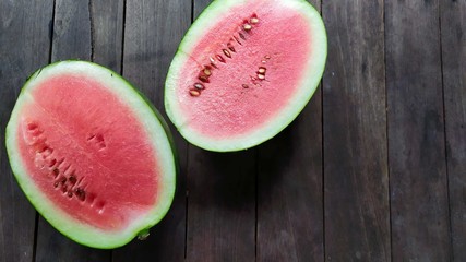 watermelon on wood background design concept in rustic 