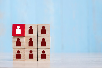 Red wooden block with white person icon on the building. People, Business, Human resource management, Recruitment, Teamwork, strategy and leadership Concepts