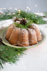 Fototapeta na wymiar Christmas cake sprinkled with powdered sugar.