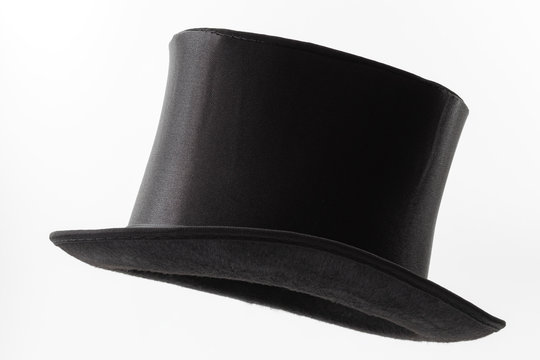 Vintage men fashion and magic show conceptual idea with side profile angle on victorian black top hat with clipping path cutout in ghost mannequin technique isolated on white background