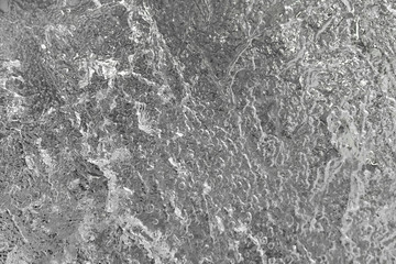 A structure and stains of frozen fragility water in black and white color. abstract natural background