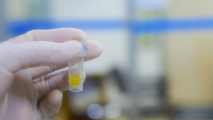 Blurred hand scientist in laboratory.