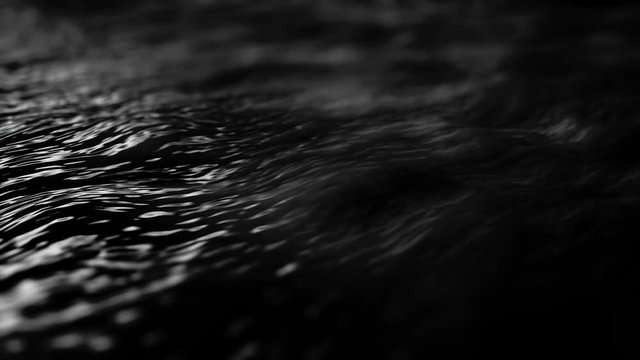 Abstract wavy surface of black color with ripples, seamless loop. Animation. Beautiful vibrant texture, flowing water with light flares, monochrome.