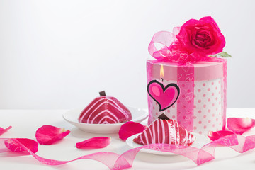 cupcake with burning candle with gift box