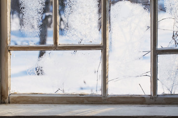 old wooden window with winter frost