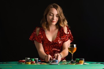Girl plays poker in a casino in a club. Card game