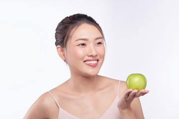 Beautiful woman holding an green apple, isolated on white background.