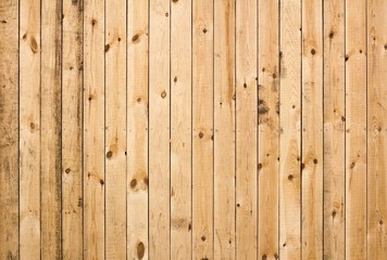 Obraz premium Texture of fresh wooden fence. New, light wooden boards. Boards with nails hammered into them. Close up