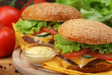 Two fresh hamburgers with vegetables	