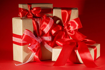 Gifts packed with craft paper and colorful satin ribbons