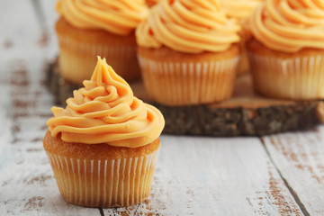 Cupcakes with orange icing on top