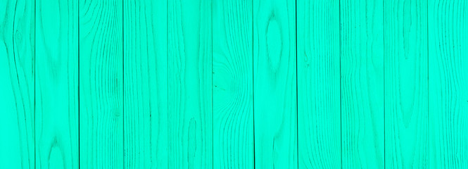Obraz premium The texture of green from old wooden planks arranged in a vertical order.