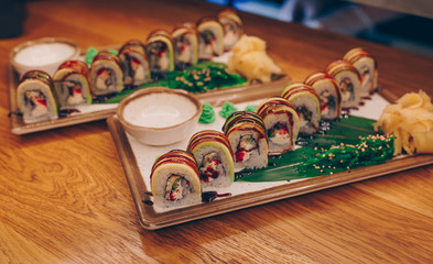 Close-up Set Philly california avocado eel smoked Red Green dragon California ,Ebi Roll philadelphia rolls assorti ginger seaweed in night dining restaurant. Delicious Sushi rolls served in a bar.