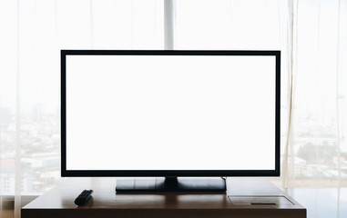 Mockup image of blank display screen television on wood table.