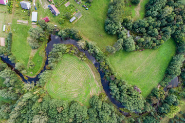Overhead view of foliage trees, fields and roads in Western Europe. Aerial photography.