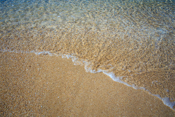 beautiful sandy beach and soft blue ocean wave