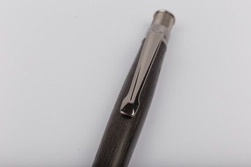 Exotic, Luxury Iroko wood bolt-action pen with chrome metal fixtures and beautiful knot in the wood - Product Photo Ballpoint Pen Handmade Hand Crafted.