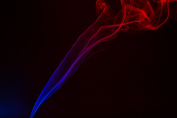 Colorful smoke close-up on a black background