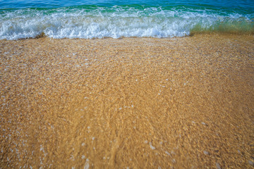 beautiful sandy beach and soft blue ocean wave