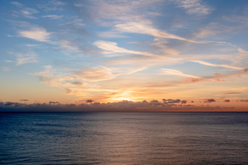 The sun set over the clouds and casts beautiful golden colours across the skies. 