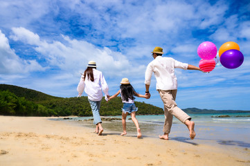 Parent father and mother help to holding hand of kid, care and always support to success destination of life, enjoy hold hand together on the sea beach