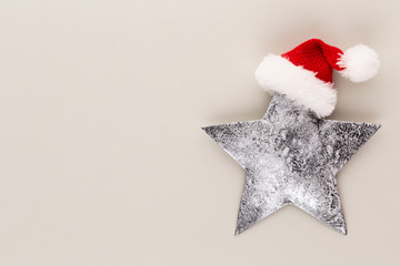 Christmas star, decor on pastel colored background. Christmas or New Year minimal concept.