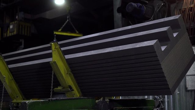Turning graphite block electrode plant. Automated technical production. Close up