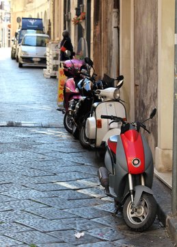 Palermo, Italy - April 30, 2017: evocative image of scooters parked along the street