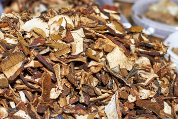 Sliced dried mushrooms on the counter on a sunny day, close-up texture and background