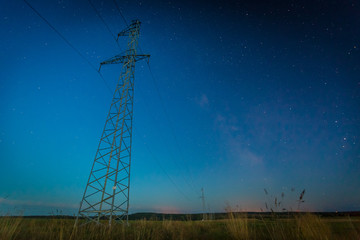 Night starry sky and power line