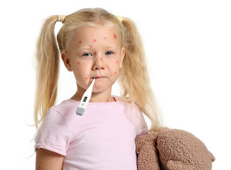 Little girl ill with chickenpox on white background