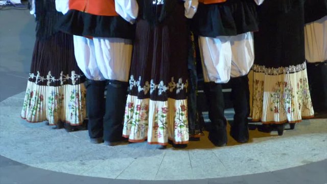 Typical Sardinian dancers. The shot is cut at the waist level and focuses on the steps movements