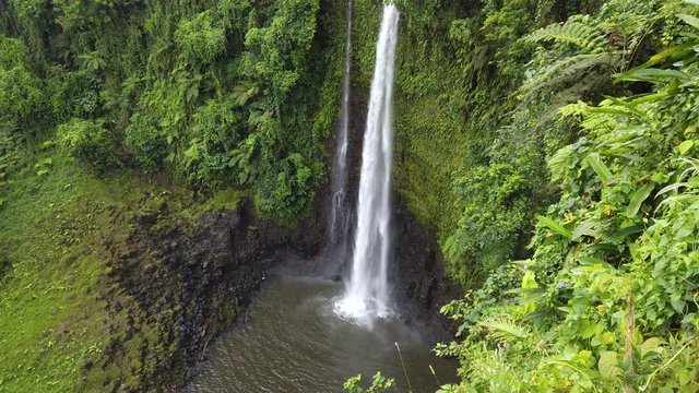 Fuipisia Waterfall in Samoa amongst the lush green landscape