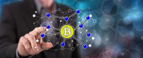 Man touching a bitcoin concept