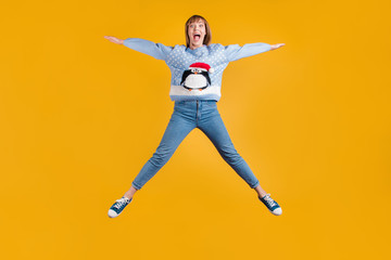 Fototapeta na wymiar Omg I can fly. Full body photo of pretty funky comic joking screaming enjoying life having good mood hipster student stretching legs and arm to the sides in star shape isolated vivid color background