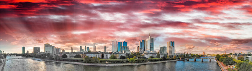 Obraz premium Frankfurt/Main Skyline Aerial Drone Shot At Sunset, view along the river