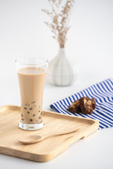 Taiwan milk tea with bubbles, ฺHomemade Milk Bubble Tea  whit dessert and table decoration, Popular Asian drink
