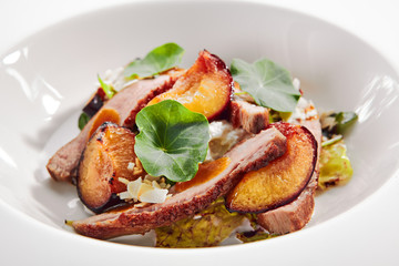 Salad with Roasted Duck Breast, Baked Pear and Strachatella