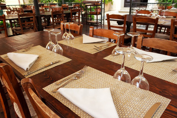 Restaurant of cafeteria terrace with classic style furniture. Southern Italy restaurant terrace on street in morning time with no people.