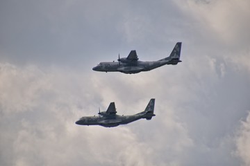  flying combat aircraft against the blue sky with clouds on a sunny day