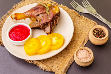 Crusty roasted duck leg. Traditional French food confit preparation