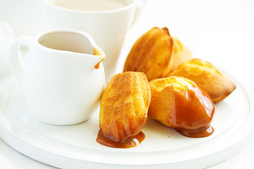 Madeleine french cookies with caramel. selective focus.