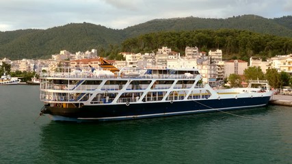 Cruise ship without people moored on the Mediterranean coast in Greece. 4K
