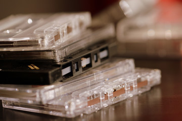 Old audio cassettes on a dark background close up. Retro style