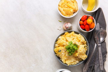 Baked macaroni and cheese, served on the dining table.Top view.