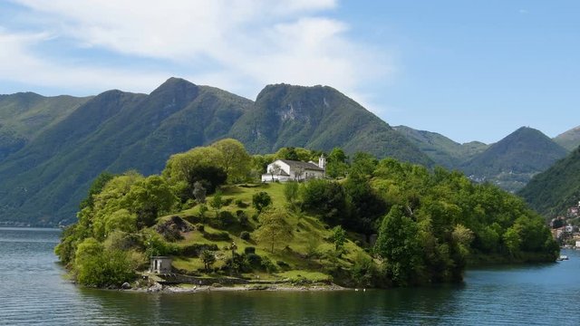 Beautiful scenary on the Comacina island with st. Eufemia church in the west coast of the Como lake one of the most famous tourist destination in the north of Italy - Real Time in 4k