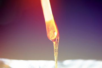 close-up sugar paste for hair removal on a black background.