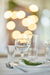 Wedding decorations. White plates on a white tablecloth. Natural style wedding